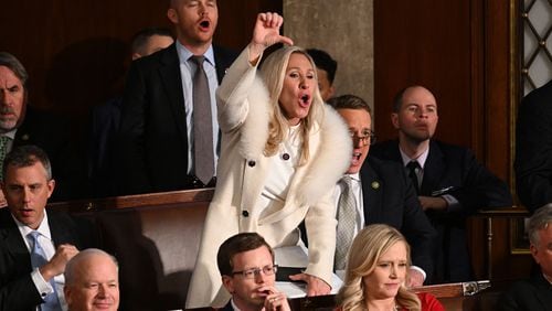 Rep. Marjorie Taylor Greene (R-GA) and Republican members of Congress react as President Joe Biden delivers the State of the Union address in the House Chamber of the U.S. Capitol on Tuesday, Feb. 7, 2023, in Washington, D.C. (Jim Watson/AFP/Getty Images/TNS)