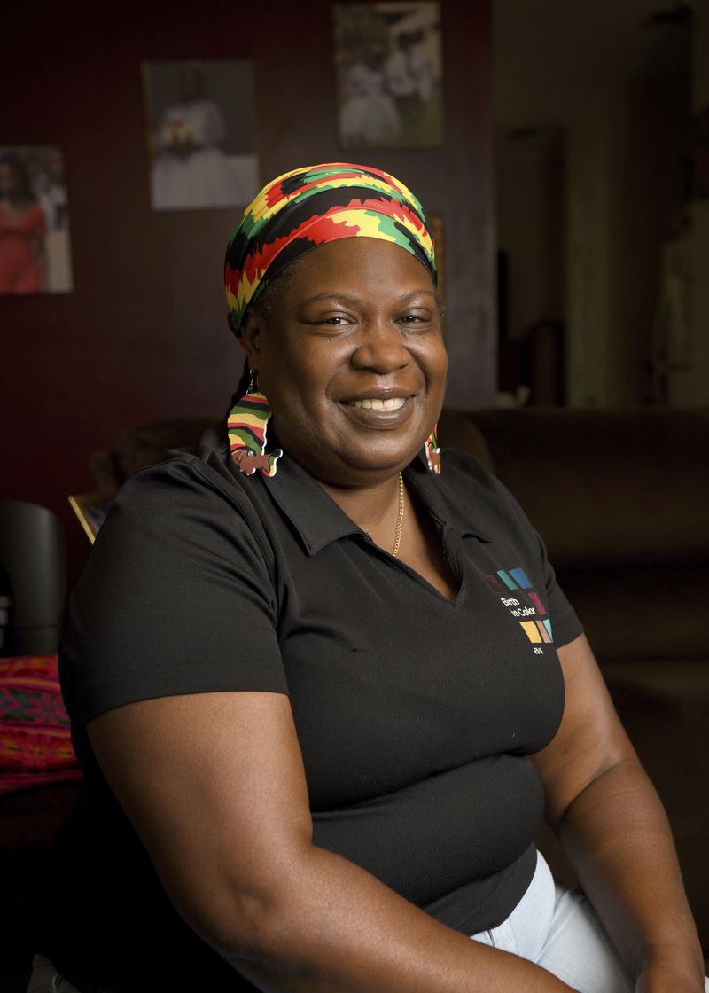 Tamika Tali, a doula with Birth in Color, sits for a portrait at home in North Carolina on July 15, 2024. The state of Virginia, where Tali works, started offering Medicaid coverage for doula services in 2022. (Natalee Waters/Cardinal News, CatchLight Local via AP)