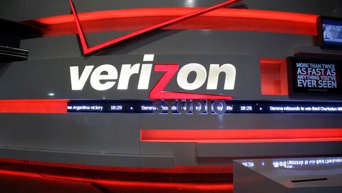 FILE - This April 7, 2013, file photo shows the Verizon studio booth at MetLife Stadium, in East Rutherford, N.J. Nearly 40,000 striking Verizon employees will return to work Wednesday, June 1, 2016, after reaching a tentative contract agreement that includes 1,300 new call center jobs, nearly 11 percent in raises over four years and the first contract for Verizon wireless store workers, a union said Monday. (AP Photo/Mel Evans, File)