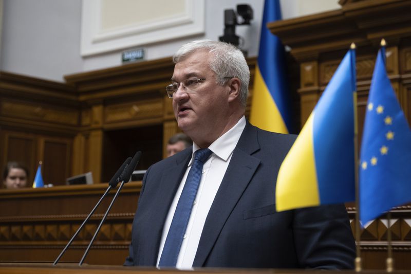 In this photo provided by the Ukrainian Parliament Press Office, Ukraine's newly appointed Foreign Minister Andrii Sybiha speaks in parliament in Kyiv, Ukraine, Thursday, Sept. 5, 2024. (Andrii Nesterewnko/Ukrainian Parliament Press Office via AP)