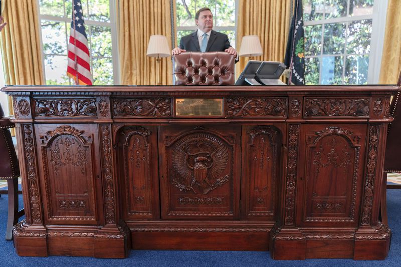 White House Historical Association President Stewart McLaurin tours members of the media in a replica of the Oval Office as is today, shown at The People's House exhibit, Monday, Sept. 16, 2024 in Washington. (AP Photo/Jose Luis Magana)