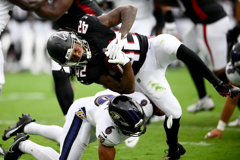 Atlanta Falcons cornerback Trey Vaval is tackled by Baltimore Ravens safety Beau Brade during the second half of a preseason NFL football game on Saturday, Aug. 17, 2024, in Baltimore. (AP Photo/Nick Wass)