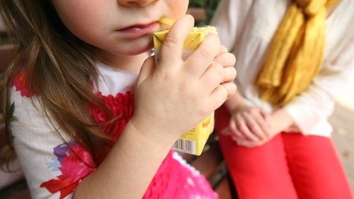 BERLIN, GERMANY - SEPTEMBER 16:  A mother sits next to her three-year-old daughter on a park bench as the girl drinks orange juice on September 16, 2012 in Berlin, Germany. Germany is currently debating the introduction of a nation-wide home child care subsidy (Betreuungsgeld), which would provide parents of one to three-year-old children the option of receiving EUR 150 (196.91 USD) a month to care for the child at home rather than sending him or her to a daycare center. Critics argue it would prevent the integration of children of recent immigrants into German society.  (Photo by Adam Berry/Getty Images)