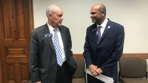 State Sen. Lindsey Tippins, R-Marietta, and Sen. Sheikh Rahman, D-Lawrenceville, discuss Rahman’s legislation that would allow some Georgia college students to get loans if they agree to pay them back with a portion of their future earnings. ERIC STIRGUS / ESTIRGUS@AJC.COM