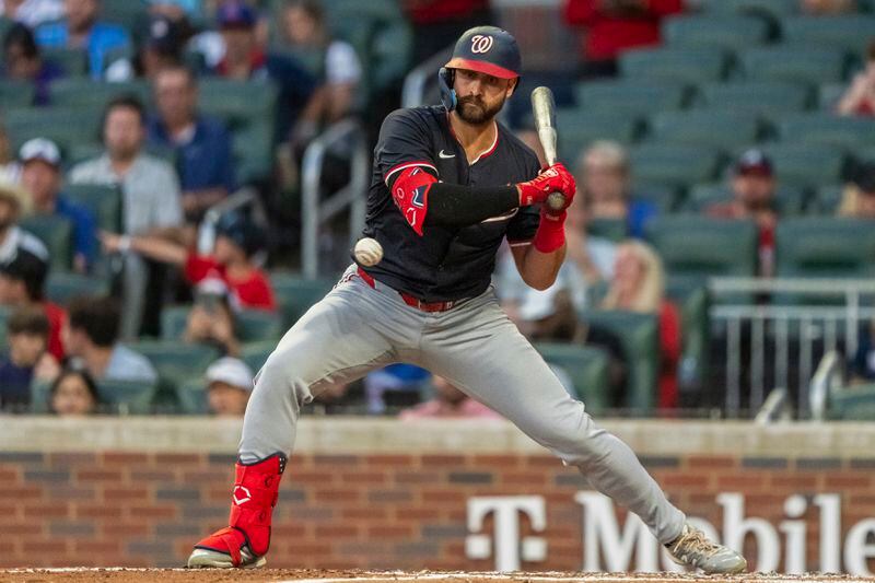 Washington Nationals' Joey Gallo watches a pitch go by called strike in the fourth inning of a baseball game against the Atlanta Braves, Friday, Aug. 23, 2024, in Atlanta. (AP Photo/Jason Allen)