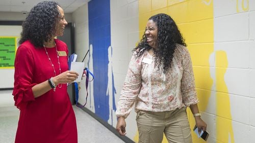 Principal Pam Williams (left) talks with first-grade teacher Tavane Glass as they walk the hallways at Bethesda Elementary School in Lawrenceville, Wednesday, April 10, 2019. ALYSSA POINTER/ALYSSA.POINTER@AJC.COM