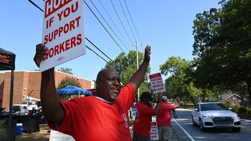 Striking AT&T workers hold signs outside AT&T facility on Brockett Road, Friday, Aug. 30, 2024, in Tucker. Some 17,000 AT&T workers in Atlanta and across the Southeast are on strike, having walked off their jobs on Aug. 16 amid an impasse in contract negotiations. (Hyosub Shin / AJC)