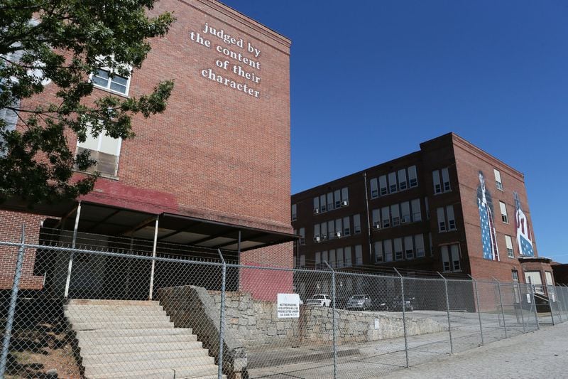 Renovation of the David T. Howard Building, shown here in 2015, into a new middle school is one of the APS construction projects that were not affected by the inflation that has raised the cost of some others. The district has already locked in a contract for the Howard renovation. BOB ANDRES / BANDRES@AJC.COM