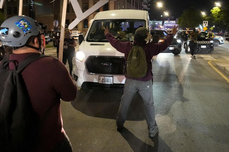 Protesters try to block traffic after a demonstration outside the Democratic National Convention Thursday, Aug. 22, 2024, in Chicago. (AP Photo/Alex Brandon)