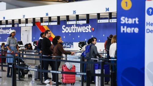 Travelers flying with Southwest Airlines wait in line at Hartsfield-Jackson International Airport in Atlanta on Friday, December 30, 2022. (Natrice Miller/natrice.miller@ajc.com)  