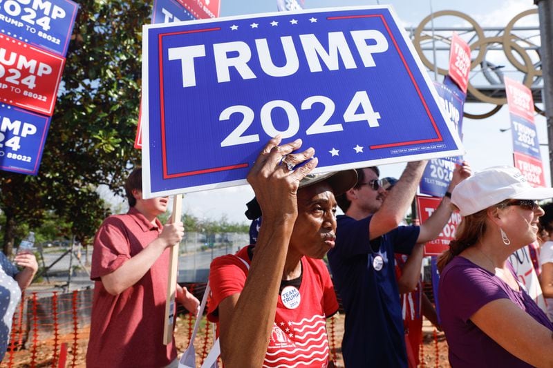 Supporters of former President Donald Trump stand across the street from Georgia State University Convocation Center to protest Vice President Kamala Harris’ first visit to Atlanta since becoming the presumptive Democratic nominee on Tuesday, July 30, 2024. (Natrice Miller/ AJC)