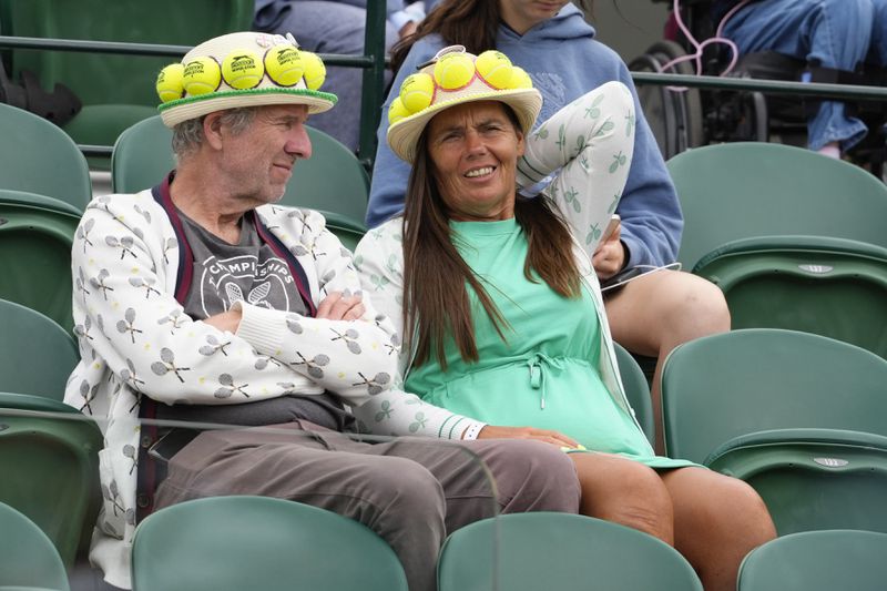 Spectators watch the Naomi Osaka of Japan and Diane Parry of France during their first round match of the Wimbledon tennis championships in London, Monday, July 1, 2024. (AP Photo/Kirsty Wigglesworth)