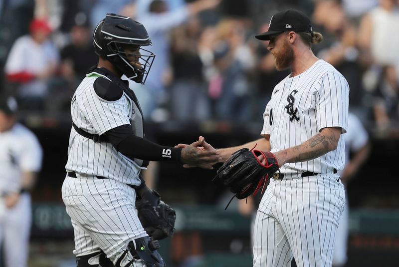Chicago White Sox's Martín Maldonado, left, celebrates with Michael Kopech after the team's win over the Atlanta Braves in a baseball game Thursday, June 27, 2024, in Chicago. (AP Photo/Melissa Tamez)