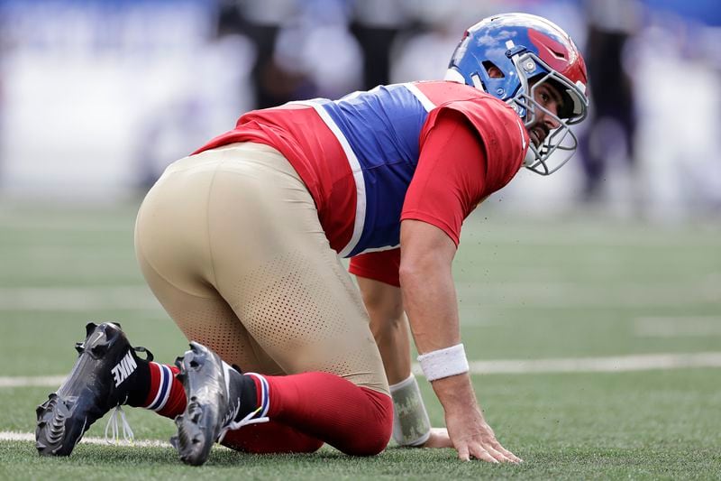 New York Giants quarterback Daniel Jones (8) looks on after being tackled during the second half of an NFL football game against the Minnesota Vikings, Sunday, Sept. 8, 2024, in East Rutherford, N.J. (AP Photo/Adam Hunger)