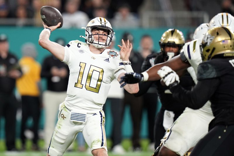 FILE - Georgia Tech quarterback Haynes King (10) throws a pass against Central Florida during the second half of the Gasparilla Bowl NCAA college football game Friday, Dec. 22, 2023, in Tampa, Fla. (AP Photo/Chris O'Meara, File)