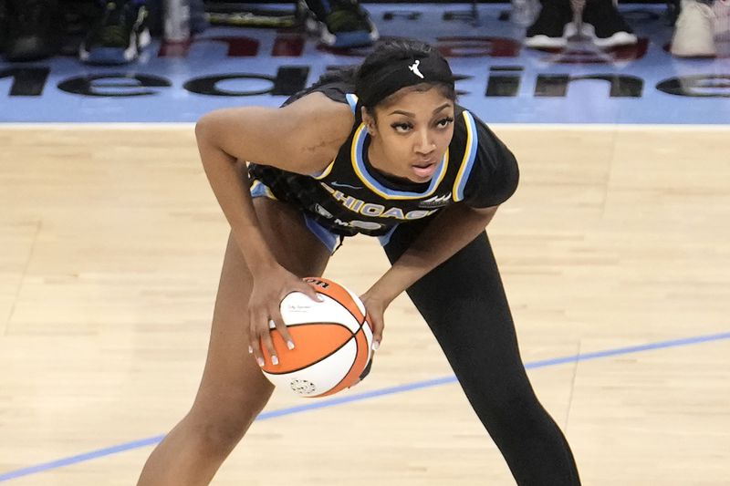 FILE - Chicago Sky's Angel Reese looks to pass during the team's WNBA basketball game against the Los Angeles Sparks on Thursday, May 30, 2024, in Chicago. (AP Photo/Charles Rex Arbogast, File)