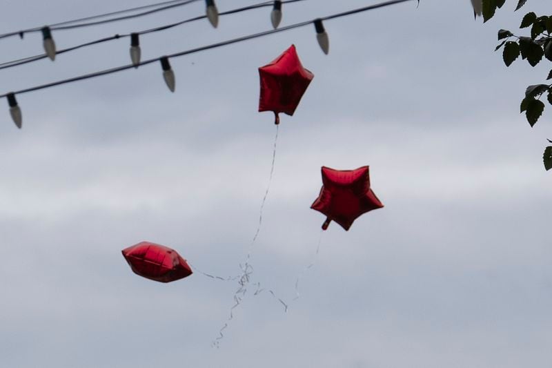 Balloons float into the air following the funeral of Mason Alexander Schermerhorn in Jefferson on Saturday, Sept. 14, 2024.   Ben Gray for the Atlanta Journal-Constitution