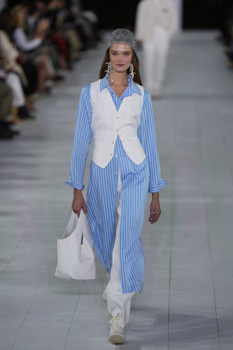 A model walks the runway during the Ralph Lauren Spring/Summer 2025 fashion show as part of New York Fashion Week on Thursday, Sept. 5, 2024, at Khalily Stables in Bridgehampton, N.Y. (Photo by Charles Sykes/Invision/AP)