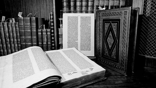 FILE - Two volumes of the over 500-year-old Gutenberg Bible are pictured in New York in April 1978. Johannes Gutenberg planned on printing 150 Bibles, but increasing demand motivated him to produce 30 extra copies, which led to a total of 180. Currently known as the “Gutenberg Bibles”, around 48 complete copies are preserved. (AP Photo/G. Paul Burnett, File)