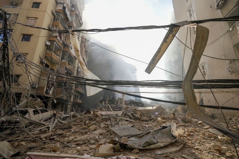 Smoke rises from the site of an Israeli airstrike in Dahiyeh, Beirut, Lebanon, Thursday, Oct. 3, 2024. (AP Photo/Hassan Ammar)