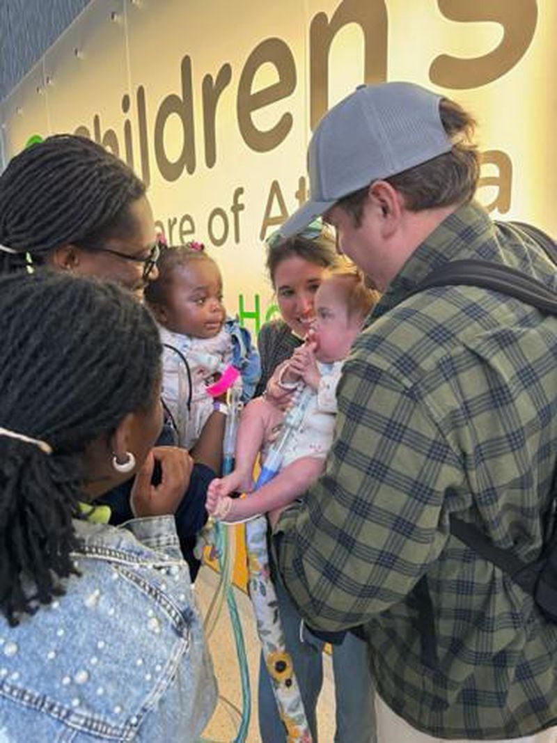 (From left) Love, Teddy and Royal Dacius and Torri, Wynnie and Alex Deason during Royal’s discharge from Scottish Rite Hospital in Sandy Springs. (Courtesy of Children’s Healthcare of Atlanta)