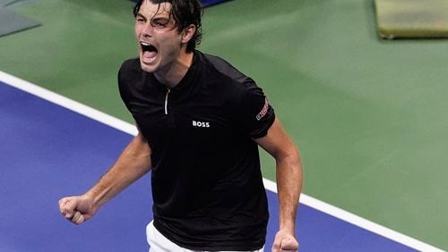 Taylor Fritz, of the United States, reacts after defeating Frances Tiafoe, of the United States, during the men's singles semifinal of the U.S. Open tennis championships, Friday, Sept. 6, 2024, in New York. (AP Photo/Julia Nikhinson)