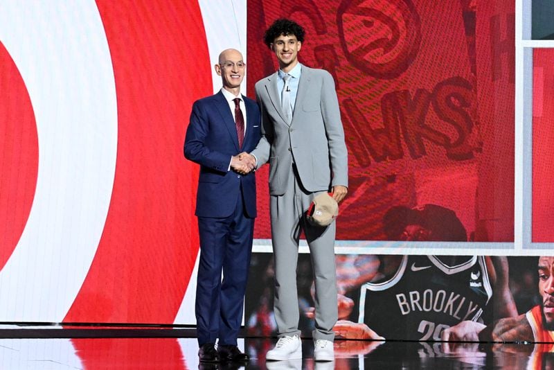 Zaccharie Risacher poses with NBA commissioner Adam Silver after being selected first by the Atlanta Hawks in the first round of the 2024 NBA Draft at Barclays Arena on Wednesday, June 26, 2024 in Brooklyn, NY. (Hyosub Shin / AJC)
