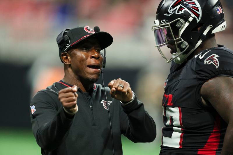 Atlanta Falcons head coach Raheem Morris talks with Atlanta Falcons defensive tackle Zion Logue during their preseason NFL game against the Jacksonville Jaguars at Mercedes-Benz Stadium, on Friday, Aug. 23, 2024, in Atlanta. The Falcons lost 31-0. (Jason Getz / AJC)
