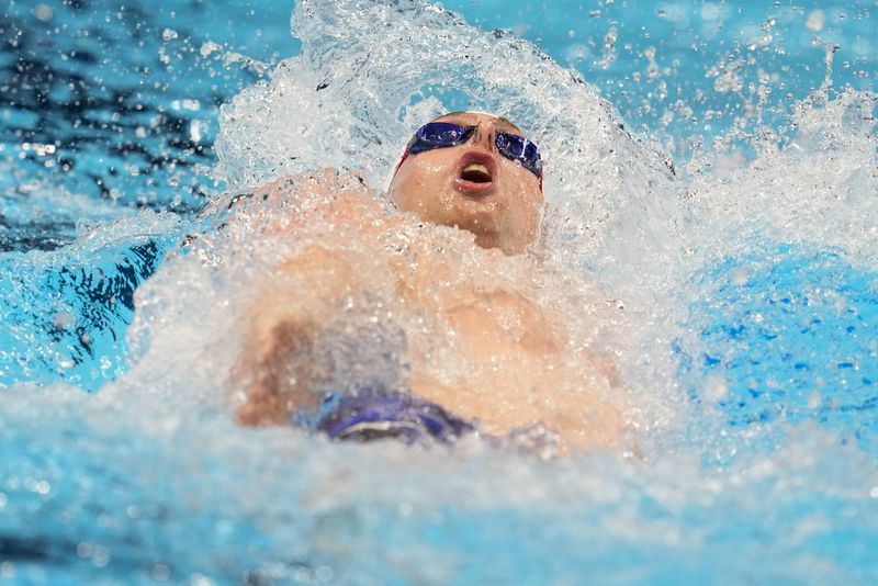 Jack Aikins swims during a Men's 200 backstroke semifinal heat Wednesday, June 19, 2024, at the US Swimming Olympic Trials in Indianapolis. (AP Photo/Michael Conroy)