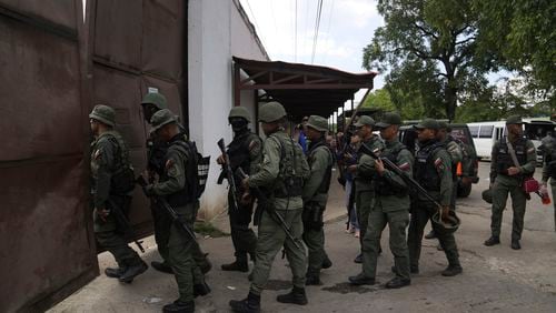 FILE - Soldiers raid the Tocorón Penitentiary Center, in Tocorón, Venezuela, Sept. 20, 2023. The Tren de Aragua gang originated at the prison. (AP Photo/Ariana Cubillos, File)