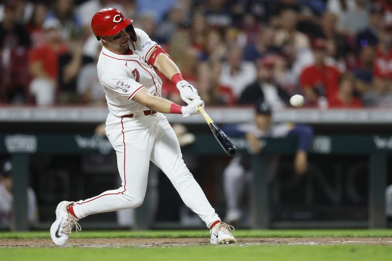 Cincinnati Reds' Spencer Steer hits a home run against the Atlanta Braves during the seventh inning of a baseball game, Tuesday, Sept. 17, 2024, in Cincinnati. (AP Photo/Jay LaPrete)