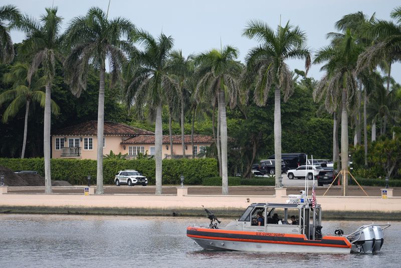 A Coast Guard boat patrols the Lake Worth Lagoon in front of the Mar-a-Lago estate of Republican presidential nominee and former President Donald Trump, one day after an apparent assassination attempt, in Palm Beach, Fla., Monday, Sept. 16, 2024. (AP Photo/Rebecca Blackwell)