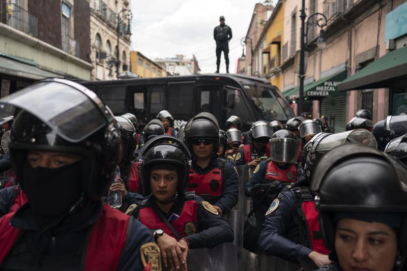 Police guard the Mexico City Congress in expectation of protests against judicial reform, Thursday, Sept. 12, 2024. (AP Photo/Felix Marquez)