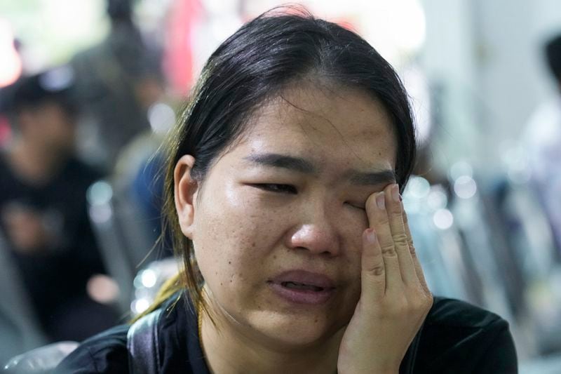 Oy Kaewprasert, mother of one of the victims of the school bus fire cries during an interview with the Associated Press at Wat Khao Phraya Sangkharam School, Lan Sak, Uthai Thani province, Thailand, Thursday, Oct. 3, 2024. (AP Photo/Sakchai Lalit)