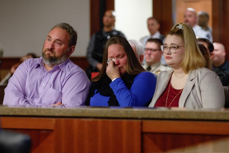Family members of the slain Cobb deputies cry in court Thursday during Christopher Golden's guilty plea. (Natrice Miller/natrice.miller@ajc.com)  