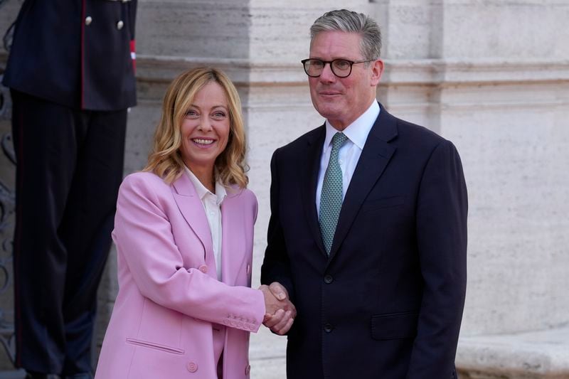 Italian Premier Giorgia Meloni, left, welcomes U.K. Prime Minister Keir Starmer as they meet at Villa Panphilj in Rome, Monday, Sept. 16, 2024. U.K. Prime Minister Keir Starmer is meeting Italian Premier Giorgia Meloni in Rome on Monday, as the two very different politicians, from left and right, seek common cause to curb migrants reaching their shores by boat. The visit comes after at least eight seaborne migrants died off the French coast over the weekend. (AP Photo Andrew Medichini)