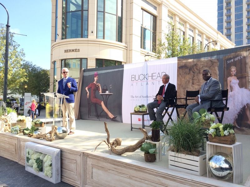 Dene Oliver (left), the CEO of Buckhead Atlanta developer OliverMcMillan, addresses attendees at the grand opening of the $1 billion project which started as the Streets of Buckhead under developer Ben Carter and stalled during the recession before OliverMcMillan took over. J. Scott Trubey/STAFF Thursday, Sept. 18, 2014.