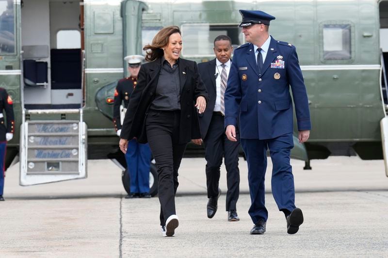 Democratic presidential nominee Vice President Kamala Harris, escorted by U.S. Air Force, Director of Flightline Protocol, Maj. Philippe Caraghiaur, walks to board Air Force Two, to travel to Pennsylvania for campaign events, Friday, Sept. 13, 2024, at Joint Base Andrews, Md. (AP Photo/Jacquelyn Martin)