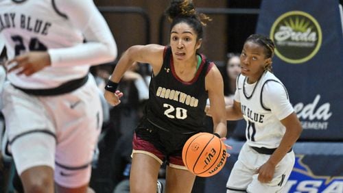 Brookwood's Diana Collins (20) brings the ball upcourt during 2023 GHSA Basketball Class 7A Girl’s State Championship game at the Macon Centreplex, Saturday, March 11, 2023, in Macon, GA. (Hyosub Shin / Hyosub.Shin@ajc.com)