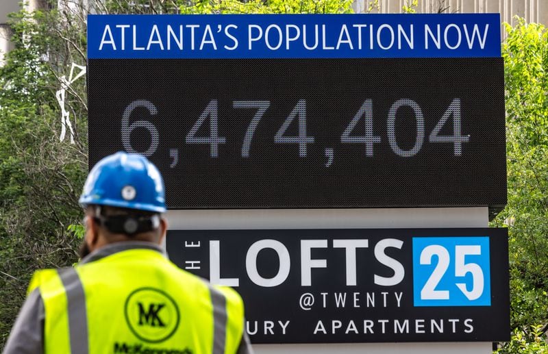 The numbers on the AtlantaÕs Population Now sign located at Brookwood Valley Circle and Peachtree Road in Atlanta keeps on growing as seen here on Wednesday, May 15, 2024. Atlanta is surpassing other cities in population growth. (John Spink/AJC)