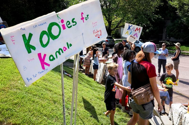 FILE - Kids hold a "Kookies for Kamala" cookie bake sale fundraiser for democratic presidential nominee Vice President Kamala Harris' campaign,Aug. 25, 2024, in Philadelphia. (Tom Gralish/The Philadelphia Inquirer via AP, File)