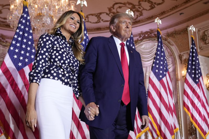 FILE - Former President Donald Trump stands on stage with former first lady Melania Trump after he announced a run for president for the third time at Mar-a-Lago in Palm Beach, Fla., Nov. 15, 2022. (AP Photo/Andrew Harnik, File)