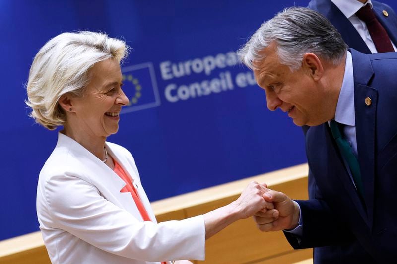 FILE- European Commission President Ursula von der Leyen, left, is greeted by Hungary's Prime Minister Viktor Orban during a round table meeting at an EU summit in Brussels, June 17, 2024. (AP Photo/Geert Vanden Wijngaert, File)