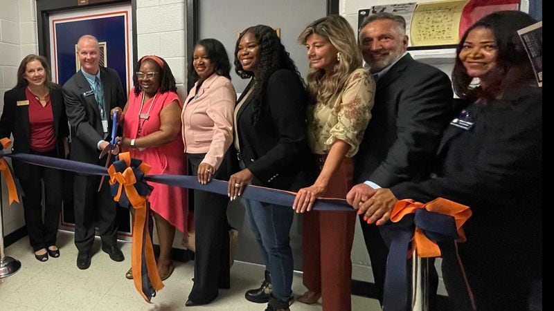 Fulton County Schools Superintendent Mike Looney (second from right) joins others in a ribbon-cutting ceremony to open a S.A.F.E. Center at North Springs High School. Photo Credit: Fulton County Schools.