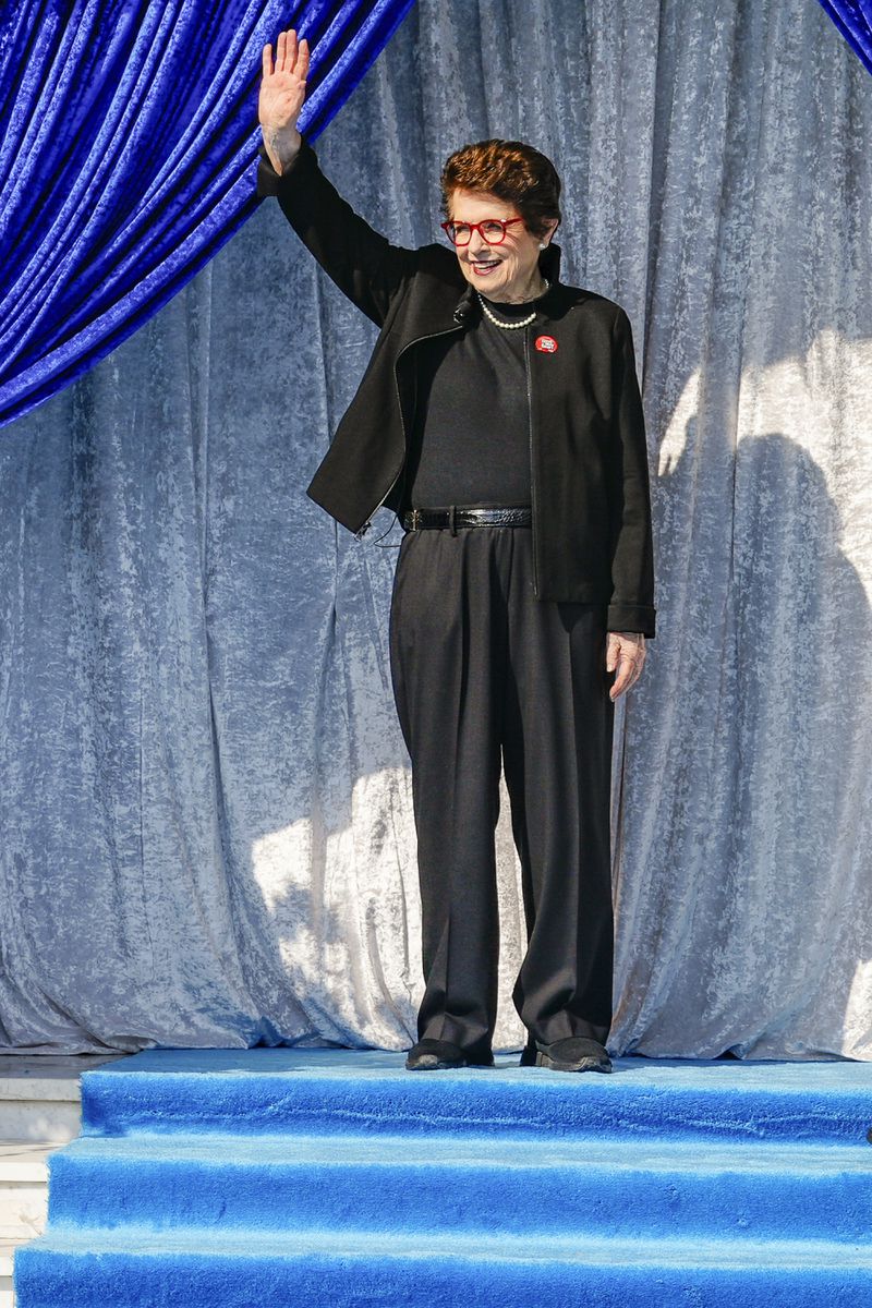 Tennis great Billie Jean King waves as she is introduced as grand marshal of the 136th Rose Parade next year on the front steps of the Tournament House in Pasadena, Calif., Monday, Oct. 7, 2024. (AP Photo/Damian Dovarganes)