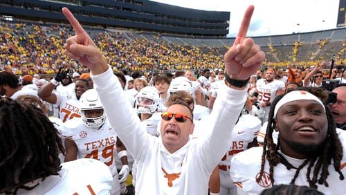 Texas head coach Steve Sarkisian celebrates after in beating Michigan 31-12 in an NCAA college football game in Ann Arbor, Mich., Saturday, Sept. 7, 2024. (AP Photo/Paul Sancya)