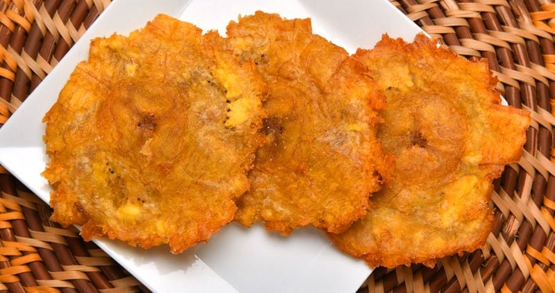 These Fried Green Plantains (Patacones) are twice fried and go well with the beef roast known as Posta Negra Cartagenera. (Styling by Christian Lopez / Chris Hunt for the AJC)