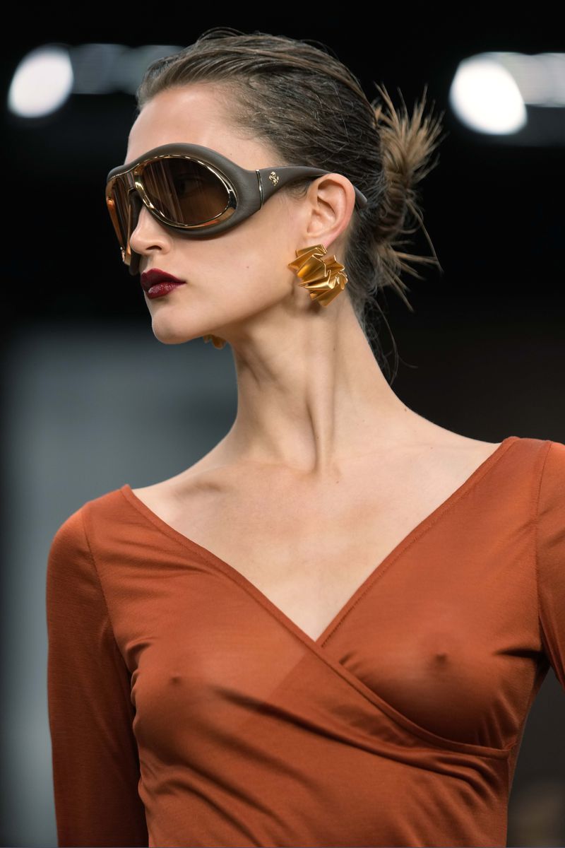 A model wears a creation as part of the Ferrari Spring Summer 2025 collection, that was presented in Milan, Italy, Saturday, Sept. 21, 2024. (AP Photo/Luca Bruno).