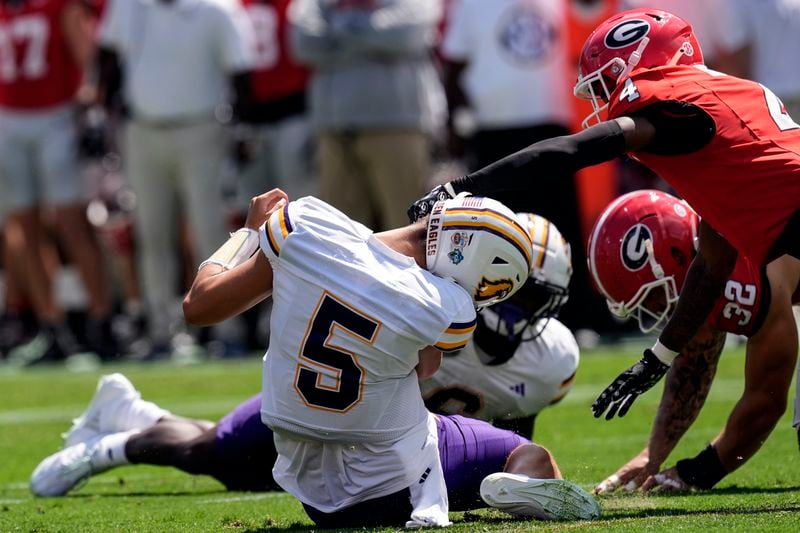 Tennessee Tech quarterback Jordyn Potts (5) is sacked by Georgia defensive back KJ Bolden (4) during the first half of an NCAA college football game Saturday, Sept. 7, 2024, in Athens, Ga. (AP Photo/John Bazemore)