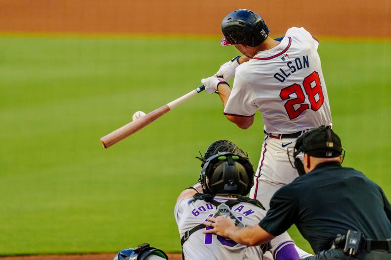 Atlanta Braves' Matt Olson (28) hits the ball to center field and it is caught in the first inning of a baseball game against the Colorado Rockies, Thursday, Sept. 5, 2024, in Atlanta. (AP Photo/Jason Allen)